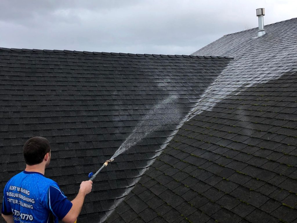 Professional roof washing service in progress